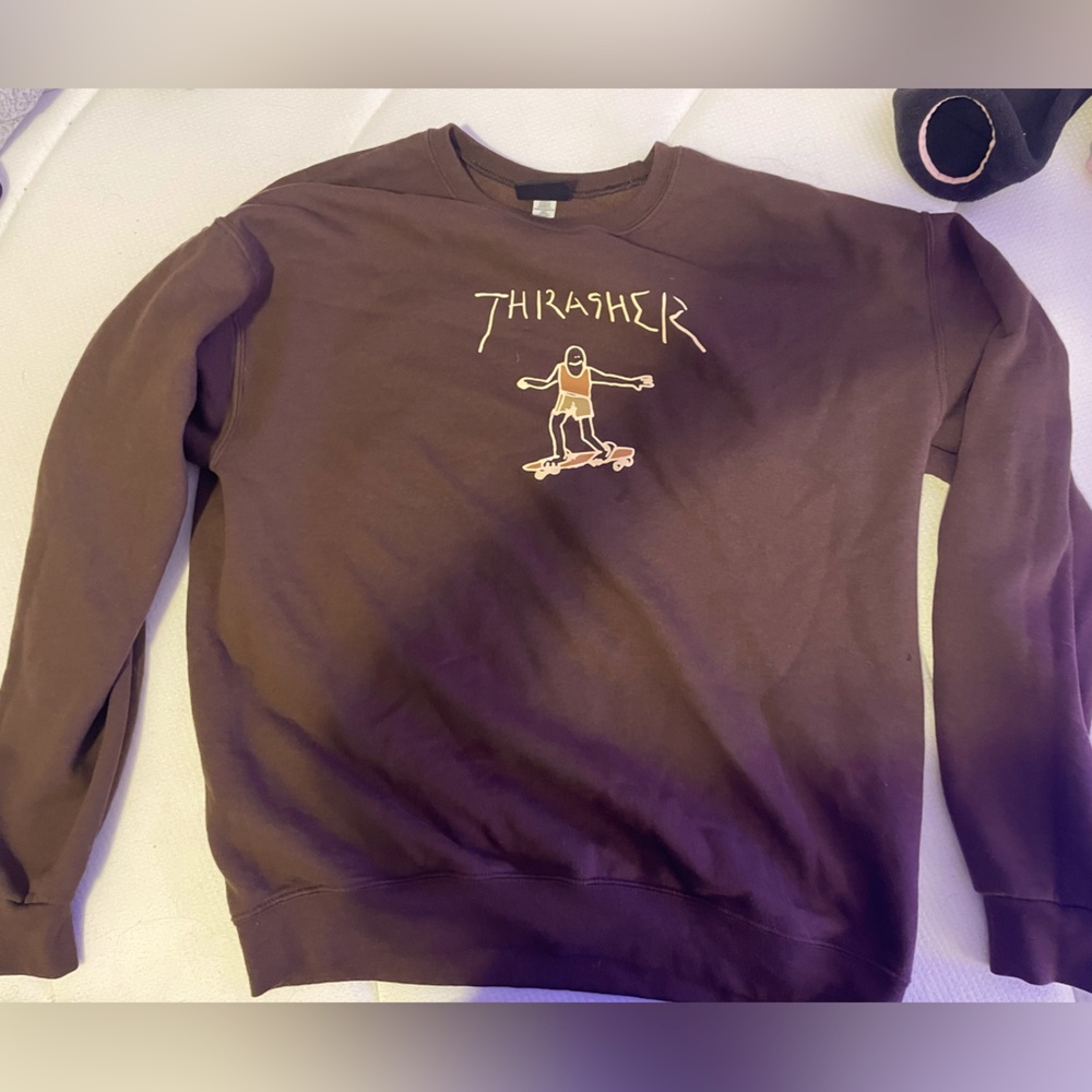 Gonz Logo Brown Crewneck Sweatshirt from Thrasher.
Gonz character across chest
